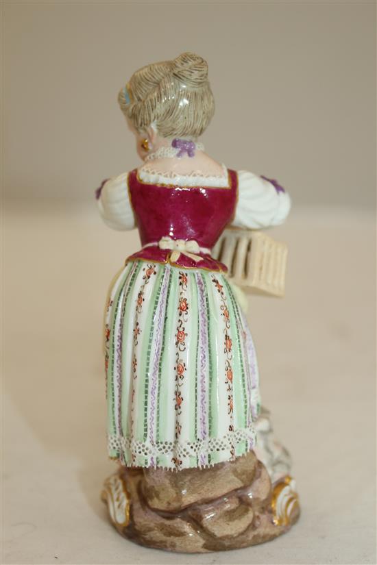 A Meissen figure of girl holding a birdcage, 19th century, 11.5cm